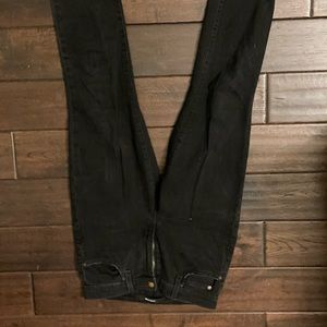 Skinny black jeans with rips.